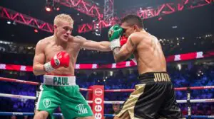 Illustration of Jake Paul securing a victory over Julio Cesar Chavez Jr. in the boxing ring (AI-generated, non-realistic illustration). Credit: Ideogram.